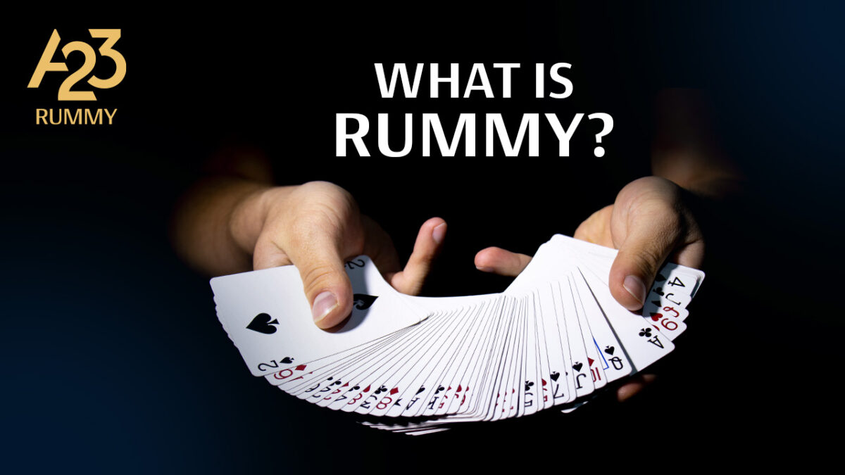 A23 Rummy banner image with 2 human hands spreading a deck of cards in his hands along with the write-up, What is Rummy?