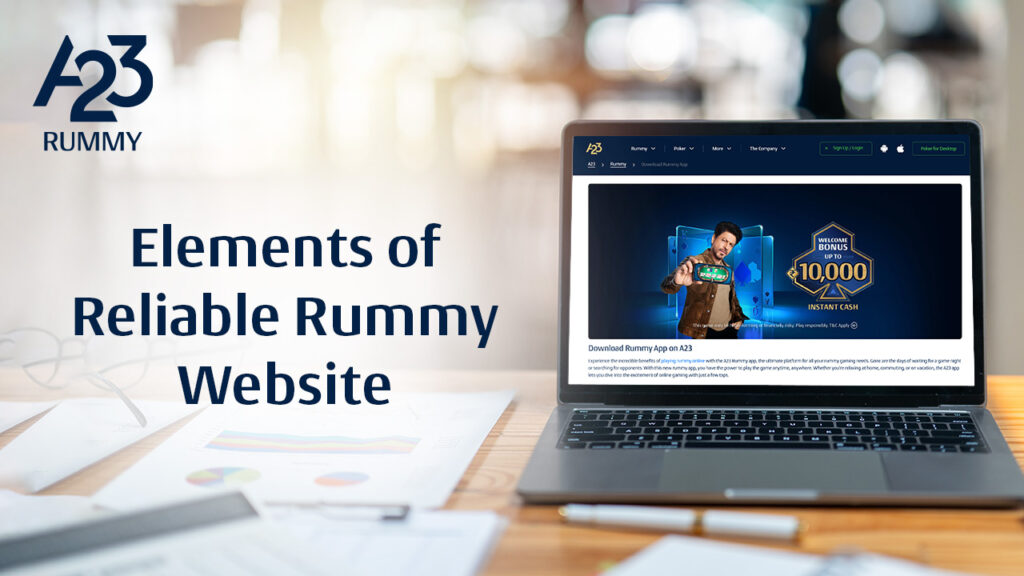 A23 rummy banner image with a working desk with paperwork, spectacles, pen and laptop on which download A23 rummy app webpage is opened along with elements of reliable online rummy website as the write-up on the image