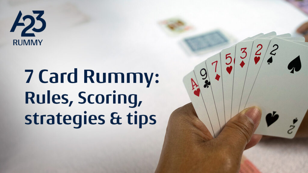 A23 rummy banner image from the perspective of a player playing rummy at a table holding his set of cards in hand in the foreground and a table with closed and open deck in the background. Also, 7 card rummy: rules, scoring, strategies & tips as a writeup on the banner.