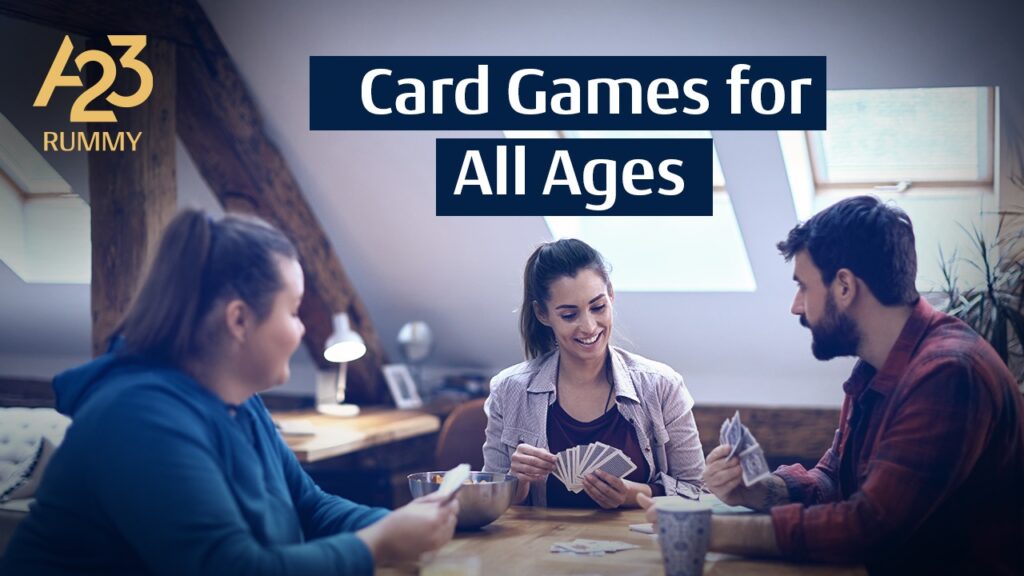 A23 Rummy banner image with 2 women and a man playing cards at a wooden table in a house and card games for all ages as a write-up on it