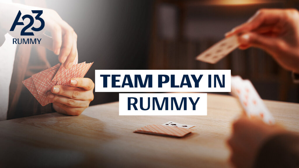 A23 Rummy banner image where 2 people playing rummy at a table and "Team play in Rummy" as a text written on the banner image.